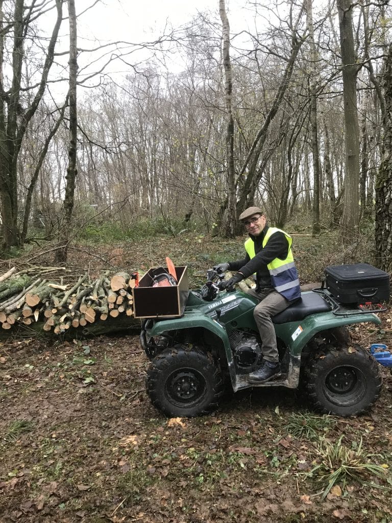 Richard building the log pile